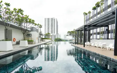 a swimming pool in the middle of a building at VIVO at 9 Seputeh by Airhost in Kuala Lumpur