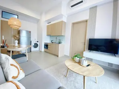 a living room with a couch and a table at Colony By Infinitum in Kuala Lumpur