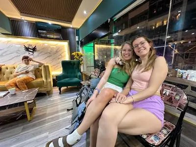 two girls sitting in a chair in a store at SS Grey Hotel in Kuala Lumpur