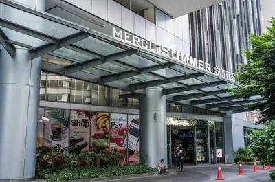 a building with a sign that reads mercedes benziner shuttle at Mercu Summer Suites Klcc by Luxe Residence in Kuala Lumpur