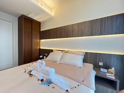 a bedroom with a bed with towels on it at Suites TribecaTRX Kuala Lumpur by ZenGlo 5min walk to The Exchange TRX in Kuala Lumpur