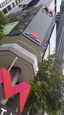 a rendering of a building with a red arrow on it at M City with Pool KLCC city view in Kuala Lumpur