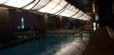 a swimming pool in a building with a view of the city at M City with Pool KLCC city view in Kuala Lumpur