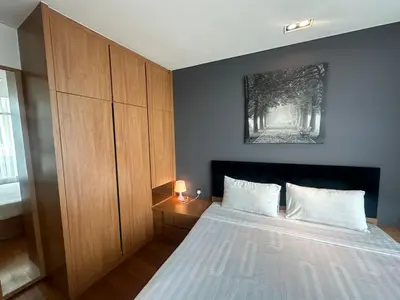 a bedroom with a bed and a picture on the wall at VORTEX STAR KLCc APARTMENT in Kuala Lumpur