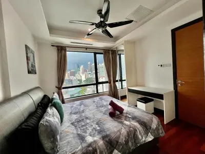 a bedroom with a bed and a ceiling fan at BBHomes at Casa Residency KL in Kuala Lumpur