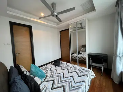 a living room with a couch and a mirror at BBHomes at Casa Residency KL in Kuala Lumpur
