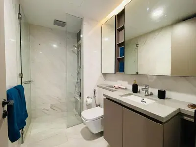 a bathroom with a toilet and a shower and a sink at Eaton Suites KLCC Kuala Lumpur in Kuala Lumpur
