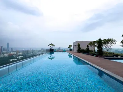 a swimming pool on the roof of a building at Riveria City KL Sentral by Sky Pool Minshuku in Kuala Lumpur