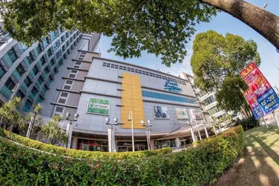 a building with a yellow stripe on the side of it at The Nova by The City Collection II in Kuala Lumpur