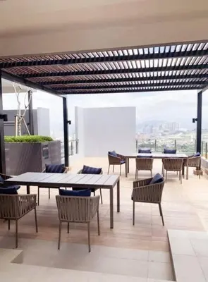 a room with tables and chairs on a building at The Nova by The City Collection II in Kuala Lumpur