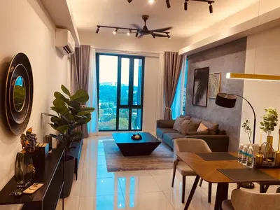 a living room with a couch and a table at Sentral Suites Kuala lumpur By Leyla 3BR suites 8 pax in Kuala Lumpur