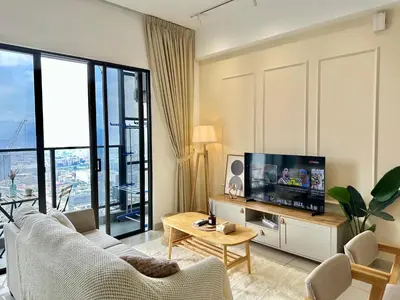 a living room with a couch and a tv at Trion KL 10mins to KLCC-Lalaport-Velocity 6 Pax in Kuala Lumpur