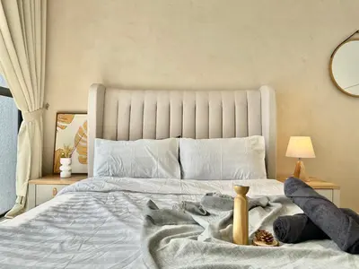a bedroom with a large white bed with a blanket at Trion KL 10mins to KLCC-Lalaport-Velocity 6 Pax in Kuala Lumpur