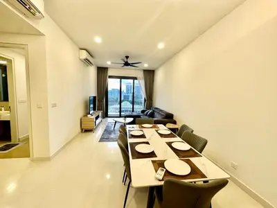 a dining room with a long table and chairs at KL Eco City Apartment by Homeizing in Kuala Lumpur