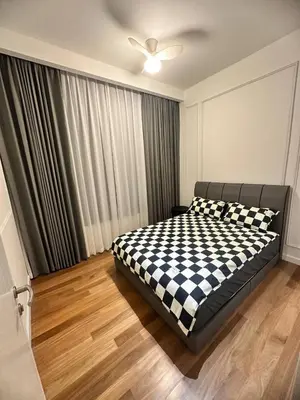 a bedroom with a black and white checkered bed at Luxury 2BR KL View, Infinity Pool, Walk to Pavilion and Jalan Alor in Kuala Lumpur