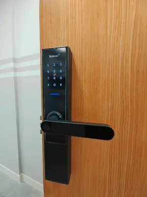 a black door handle on a wooden door at The Ooak Mont Kiara 33A# Main Street Sunway 163#1 bedroom 1-2Pax in Kuala Lumpur