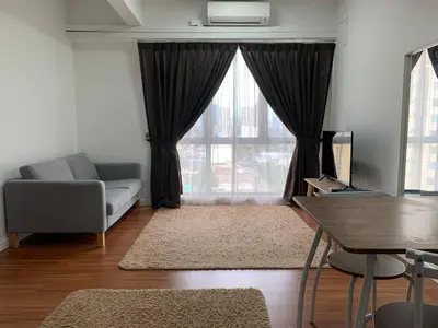 a living room with a couch and a table at Menara Arina Uniti in Kuala Lumpur