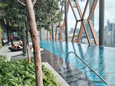 a swimming pool on the roof of a building at Luxury Apartment at Scarletz Suites Kuala Lumpur in Kuala Lumpur