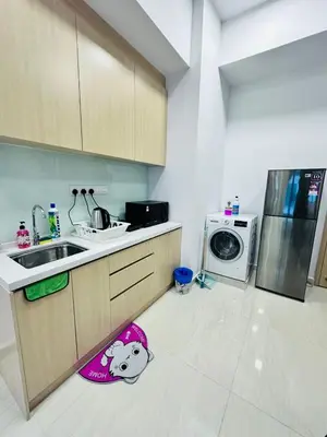 a kitchen with a hello kitty rug on the floor at The Luxe Infinitum Sky pol KLCC in Kuala Lumpur