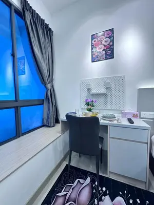 a room with a desk with a chair and a window at The Luxe Infinitum Sky pol KLCC in Kuala Lumpur