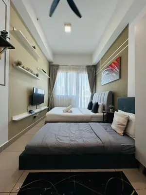 a large bedroom with two beds and a window at The Luxe Infinitum Sky pol KLCC in Kuala Lumpur