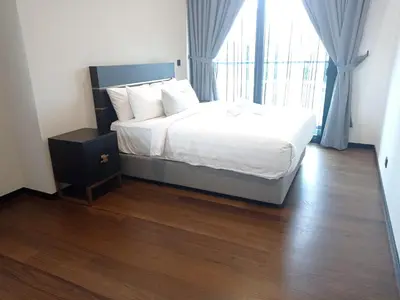 a bedroom with a bed and a large window at Kuala Lumpur Apartment at Opus Residence Near China Town and 118 Tower in Kuala Lumpur
