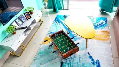 an aerial view of a living room with a table and a chessboard at 3A YOLO Budget Condo in Kuala Lumpur