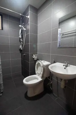 a bathroom with a toilet and a sink at KL 9Pax 10Mins to Sentul LRT, Batu Caves, MCD (Zena Suites) in Kuala Lumpur