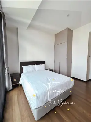a bedroom with a large bed with white sheets at Face Malaysia Tallest Tower 118 in Kuala Lumpur in Kuala Lumpur