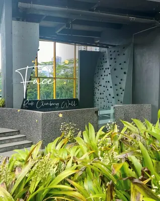 a view of a building with plants in the foreground at Face Malaysia Tallest Tower 118 in Kuala Lumpur in Kuala Lumpur