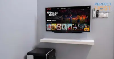 a television hanging on a wall in a room at Neu Suites @ 3rdNvenue by Perfect Host in Kuala Lumpur