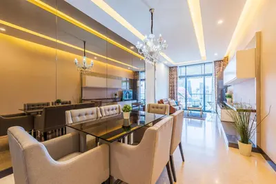 a dining room with a table and chairs at Dorsett Residence Kuala Lumpur \u5e1d\u76db\u516c\u5bd3 Bukit Bintang in Kuala Lumpur
