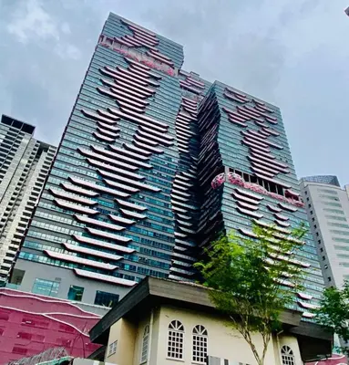 a tall building with many windows in a city at Arte plus by 2BR sweet home in Kuala Lumpur