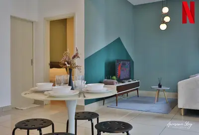 a dining room with a table and some chairs at Arte plus by 2BR sweet home in Kuala Lumpur