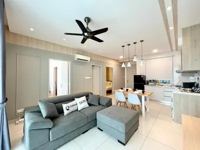 a living room with a couch and a ceiling fan at Court 28 Residence KL Suites 2 Bedroom Apartment by Sleepy Bear in Kuala Lumpur