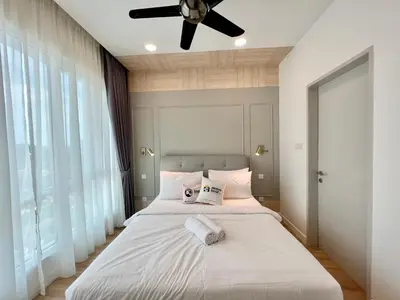 a bedroom with a bed with a ceiling fan at Court 28 Residence KL Suites 2 Bedroom Apartment by Sleepy Bear in Kuala Lumpur