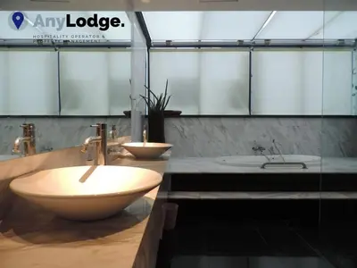 a bathroom with a sink and a tub and a sink at KL Golf Country Club Resort Villa by AnyLodge in Kuala Lumpur