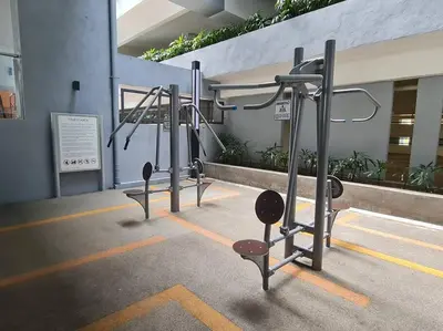 a row of gym equipment in a building at KL Creamy Tiny 2R1B Home \u7206\u6b3e\u5976\u6cb9\u98ce\u5c0f\u5b85 in Kuala Lumpur