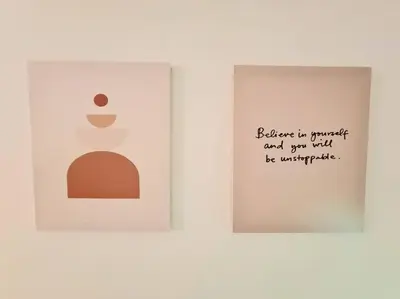 two framed pictures on a white wall with writing on it at KL Creamy Tiny 2R1B Home \u7206\u6b3e\u5976\u6cb9\u98ce\u5c0f\u5b85 in Kuala Lumpur
