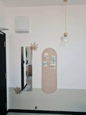a white wall with a skateboard hanging on it at KL Creamy Tiny 2R1B Home \u7206\u6b3e\u5976\u6cb9\u98ce\u5c0f\u5b85 in Kuala Lumpur