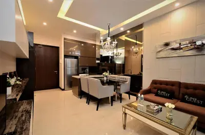a living room and kitchen with a couch and a table at The Dorsett Service Suites Bukit Bintang Kuala Lumpur in Kuala Lumpur
