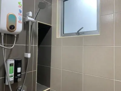 a shower in a bathroom with a window at Corner KL Pool View RC Residence with High Internet Speed 500Mbps in Kuala Lumpur