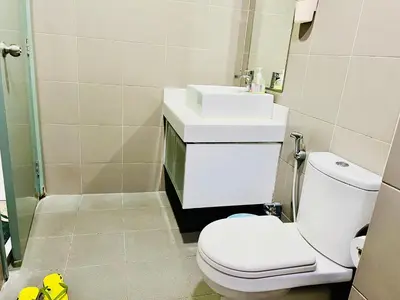 a bathroom with a white toilet and a sink at Summer suites victory house in Kuala Lumpur