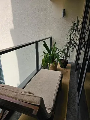 a balcony with potted plants and a bench at Luxurious Apartment St Mary Residences Resort Style in Kuala Lumpur