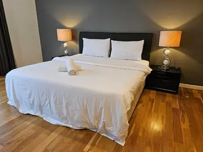 a bedroom with a bed with a teddy bear on it at Luxurious Apartment St Mary Residences Resort Style in Kuala Lumpur