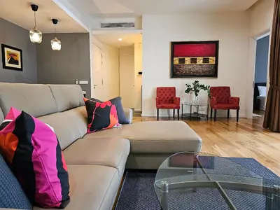 a living room with a couch and a table at Luxurious Apartment St Mary Residences Resort Style in Kuala Lumpur