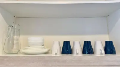 a row of blue and white vases and plates on a shelf at Extravagant Family-Biz Nest @ Robertson 30F in Kuala Lumpur