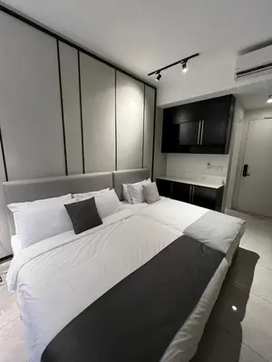 a large white bed in a large room at Bukit Bintang Axon Residences 3R2B 3Queens Beds in Kuala Lumpur