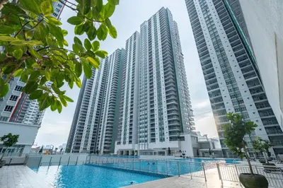 a view of two tall buildings with a swimming pool at Razak City Residence by Lisa Homestay in Kuala Lumpur