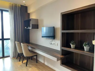 a room with a desk with chairs and a television at D'Majestic Kuala Lumpur By Luxe Home in Kuala Lumpur